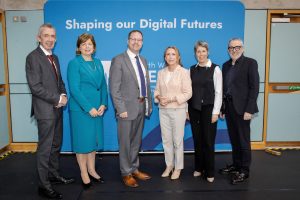 Six people standing side by side.