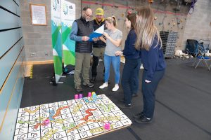 People looking at a puzzle. 